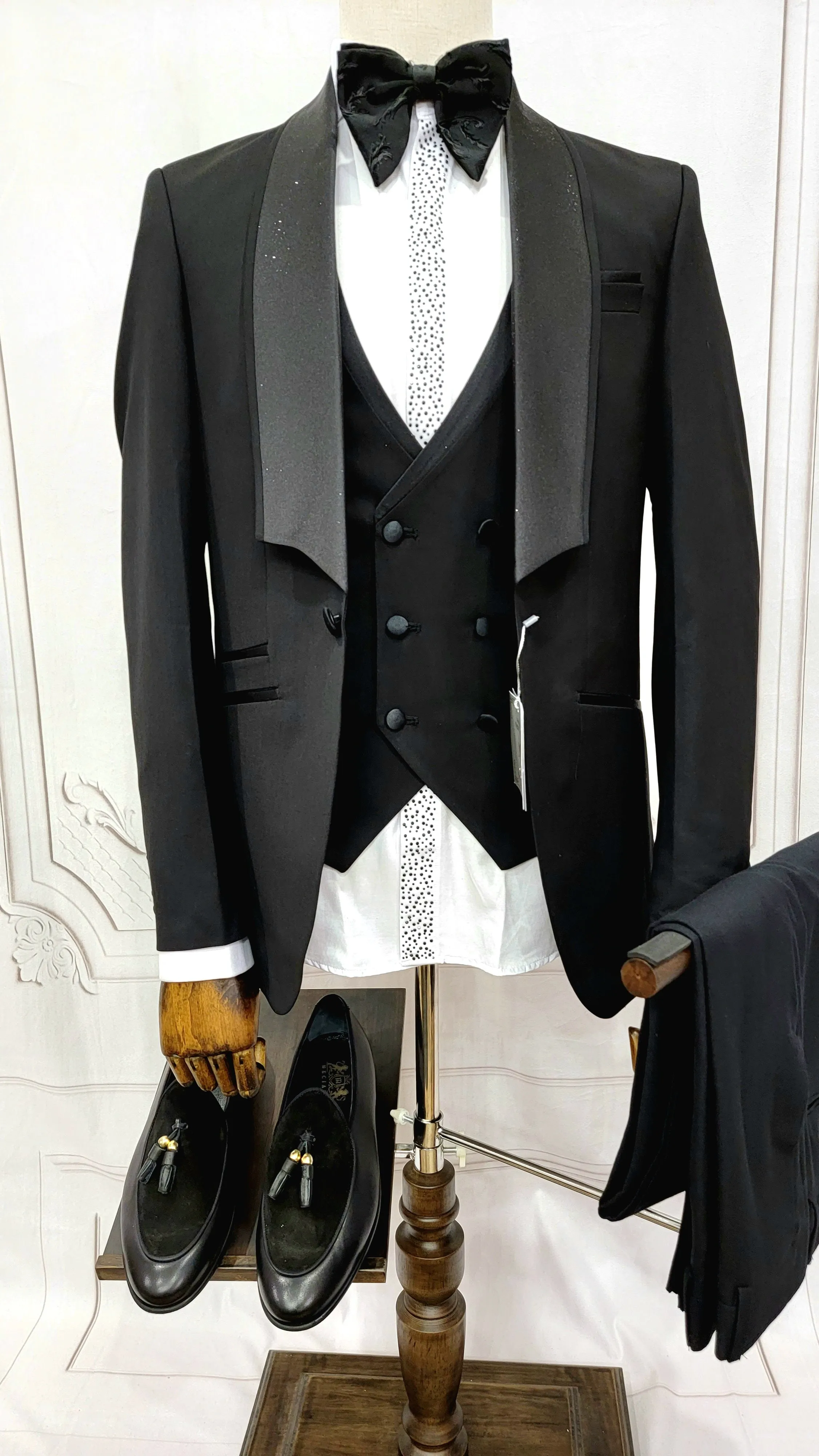 Three Piece Tuxedo suit with shiny lapel comes with matching bow tie.