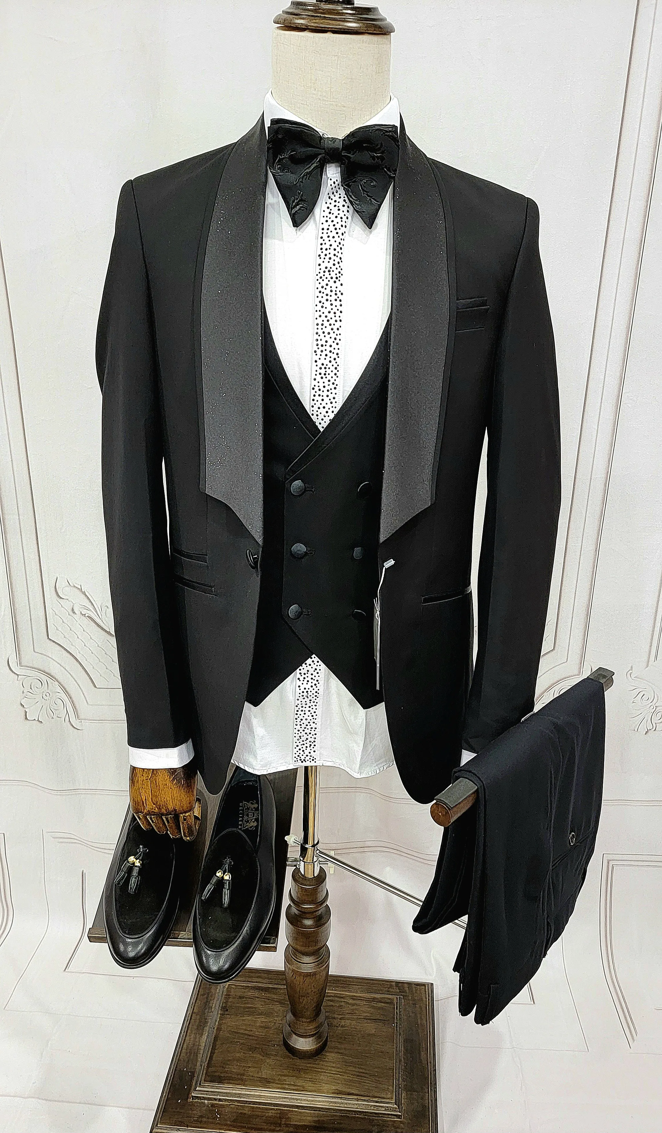 Three Piece Tuxedo suit with shiny lapel comes with matching bow tie.