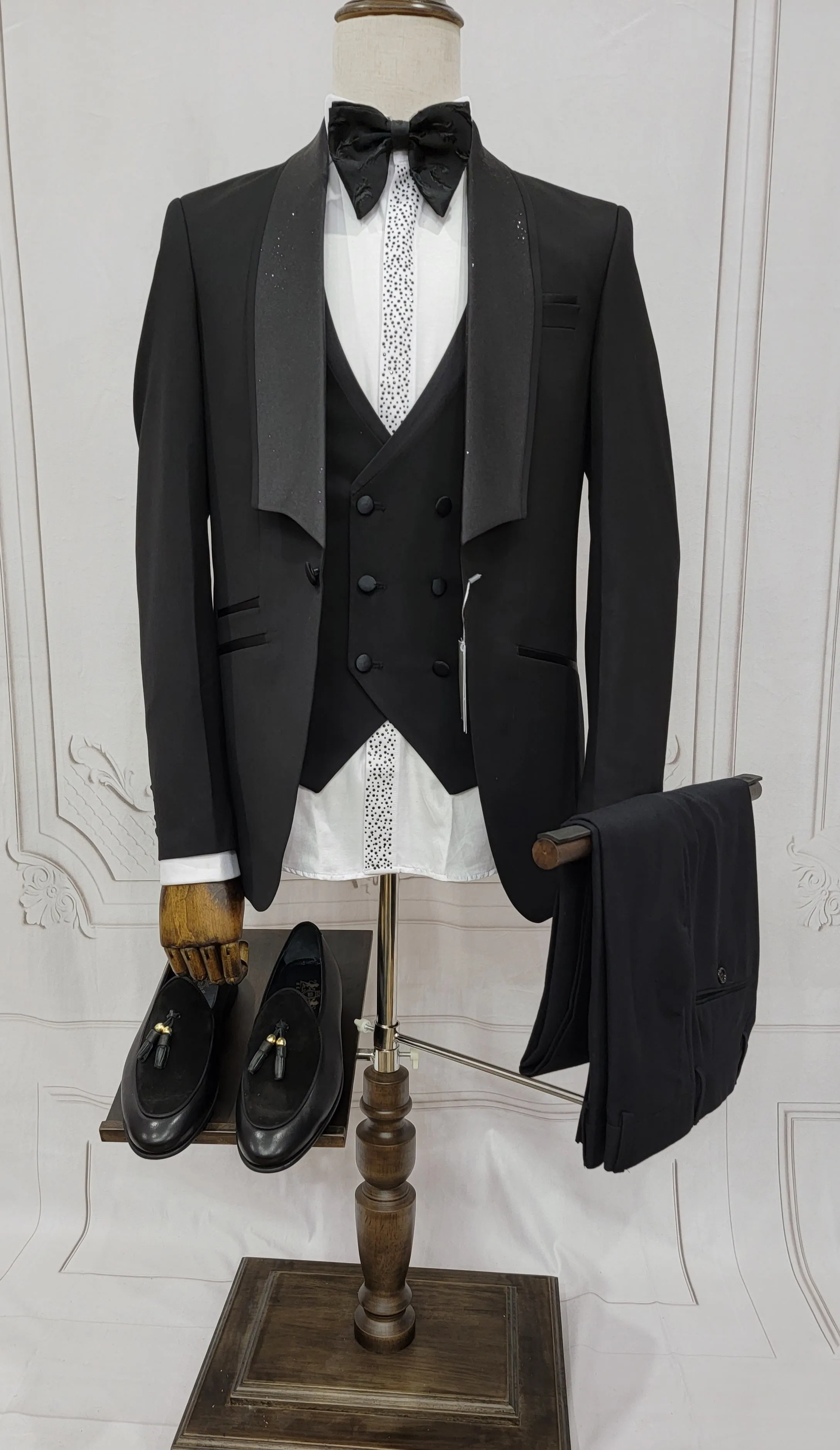 Three Piece Tuxedo suit with shiny lapel comes with matching bow tie.