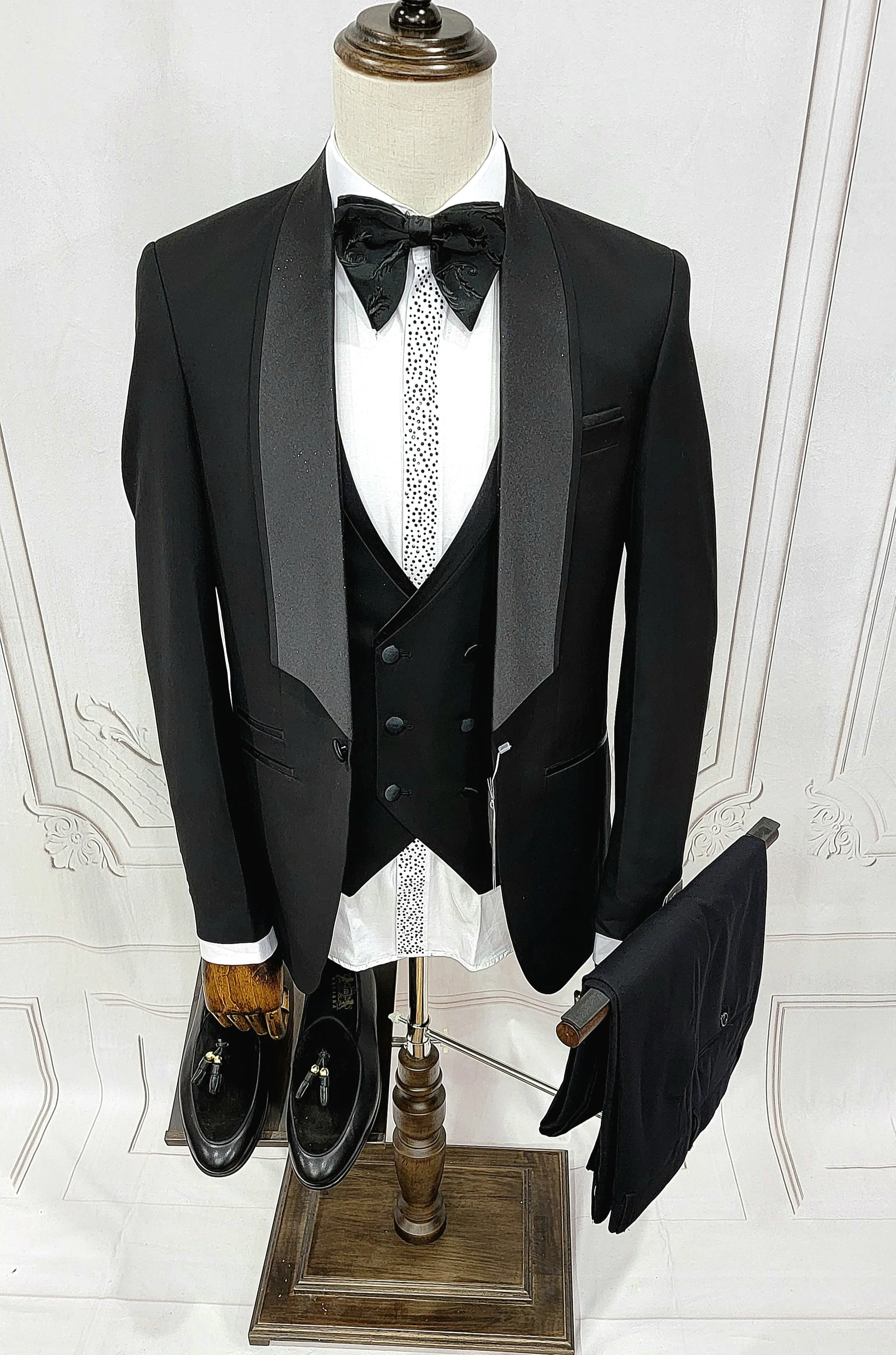 Three Piece Tuxedo suit with shiny lapel comes with matching bow tie.