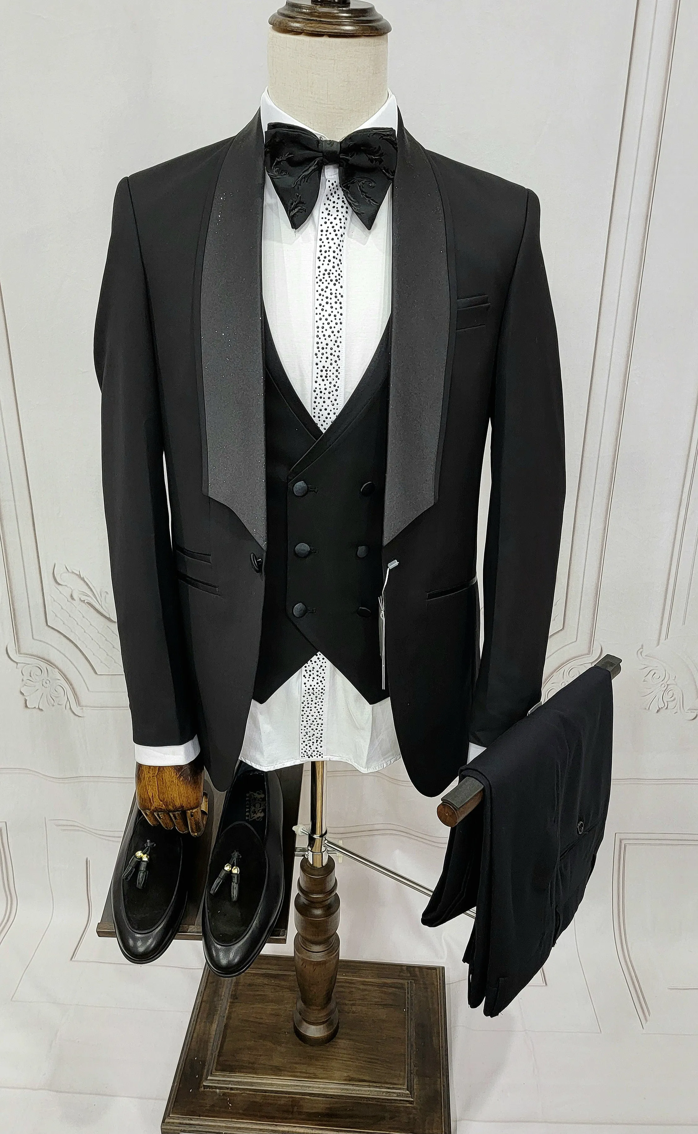Three Piece Tuxedo suit with shiny lapel comes with matching bow tie.